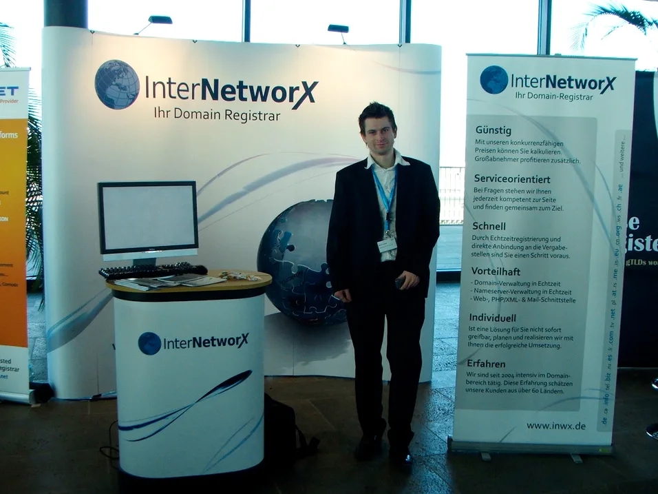 one men stand in front of the InterNetworX booth