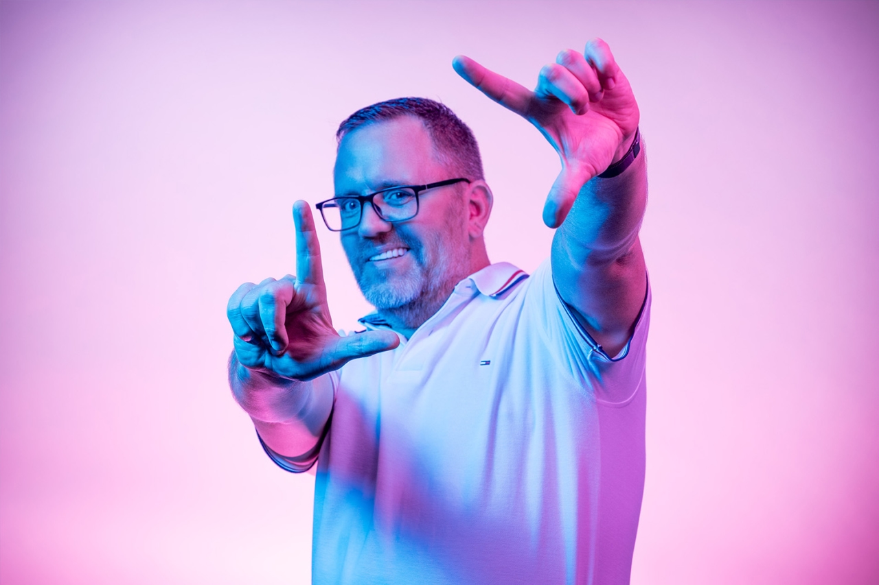 Man forms a square with his hands to the front