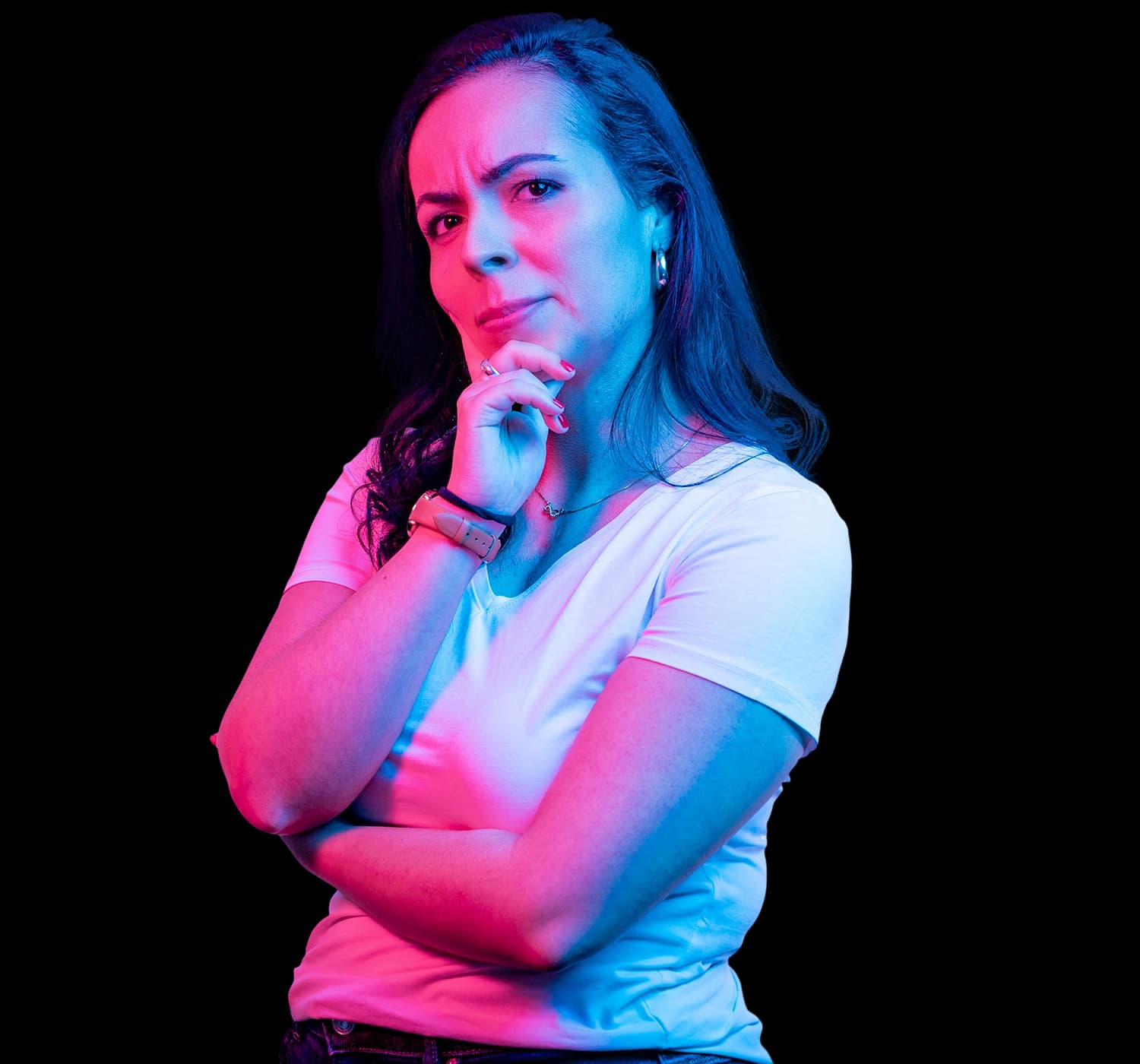 woman holding her chin thoughtfully